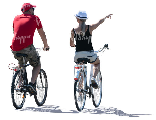 backlit man and woman biking