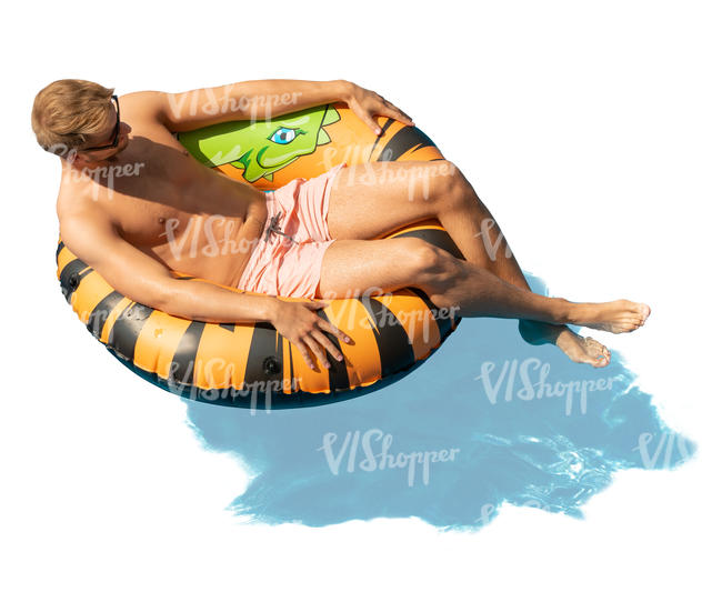 man sunbathing in a large swim ring