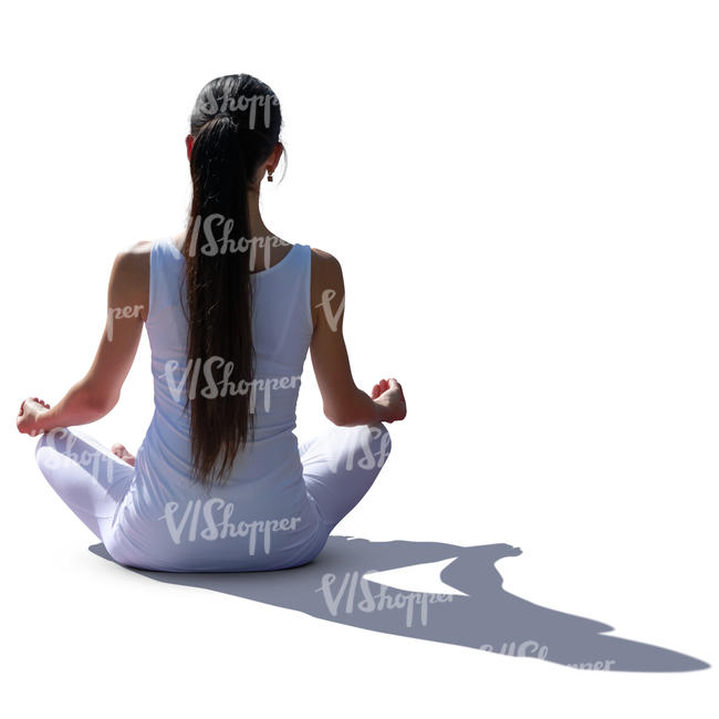 backlit woman doing yoga