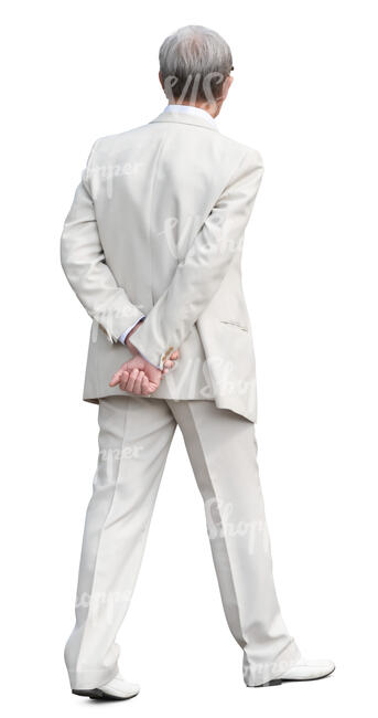 man in a white suit walking