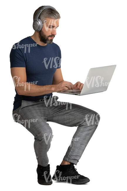 man sitting and working with a computer