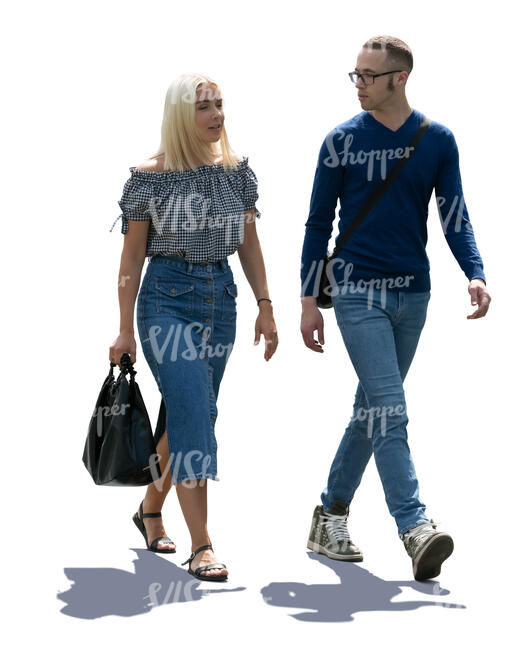 backlit man and woman walking
