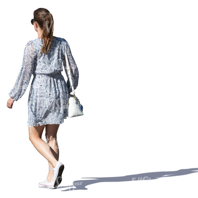 woman in a grey summer dress walking