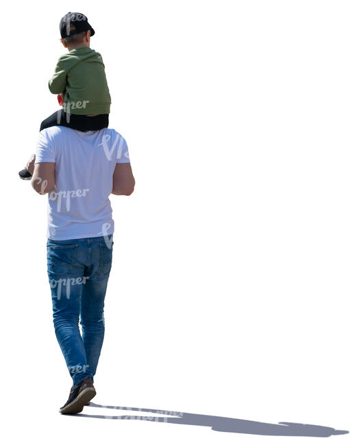 backlit man carrying his son on his shoulders