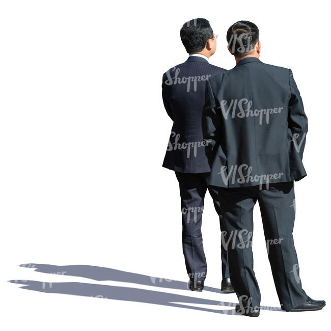 two asian businessmen standing and looking in one direction
