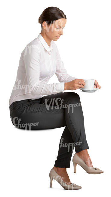 woman sitting and having a cup of coffee