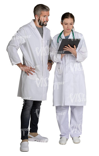 two doctors standing and looking at papers