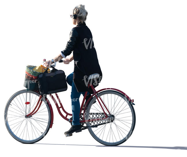 sidelit woman riding a bike