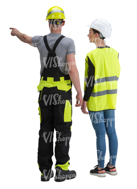 man and woman with helmets standing on construction site