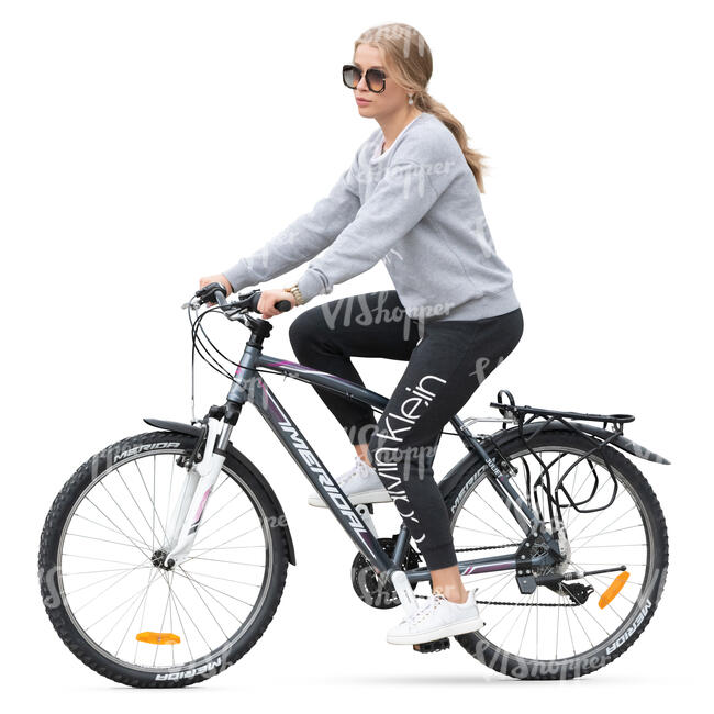 woman in sports outfit riding a bike
