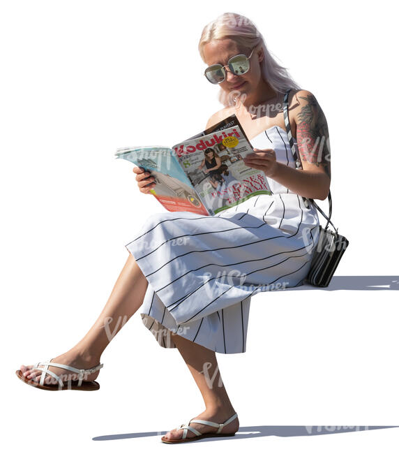 woman reading a magazine on a sunny day