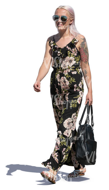 woman in a flower print jumpsuit walking