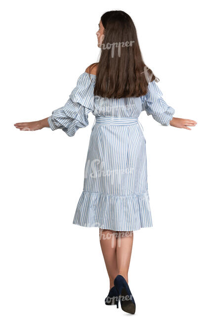 woman in a dress leaning on a balcony railing