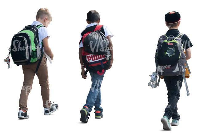 group of three boys with backpacks walking