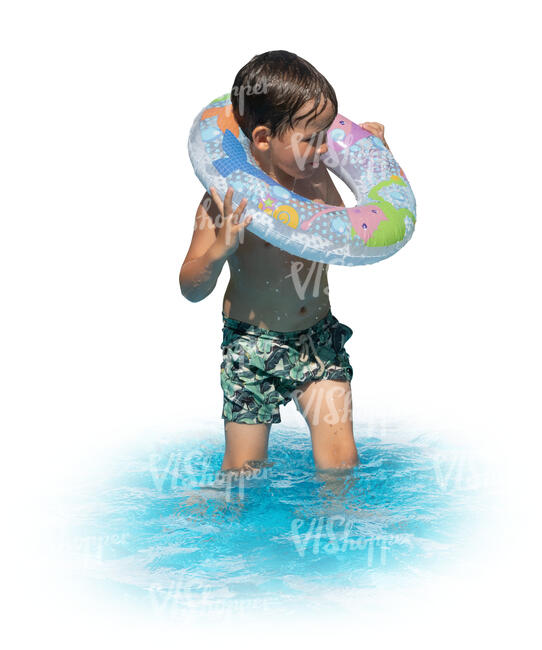 little boy with a swim ring standing in the water