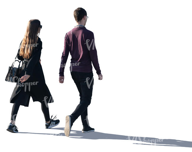 two young people walking with backlit light