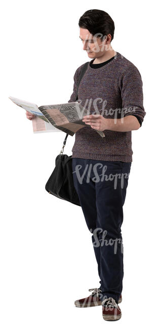 man standing and reading a newspaper