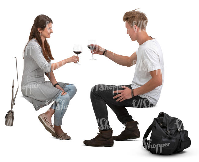 man and woman sitting and drinking wine