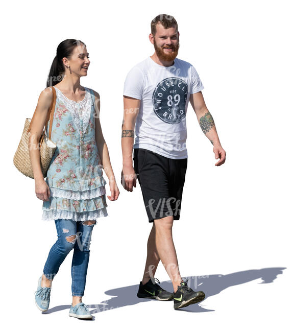 smiling man and woman walking on a sunny day