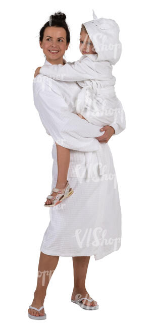 woman in a spa bathrobe standing and holding her daughter