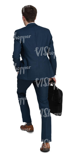 young businessman walking up the stairs