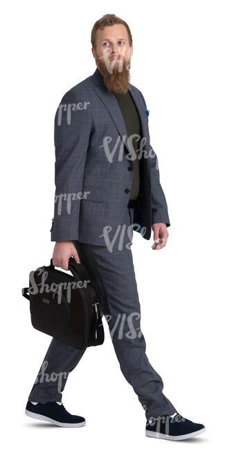 bearded man in a grey suit walking