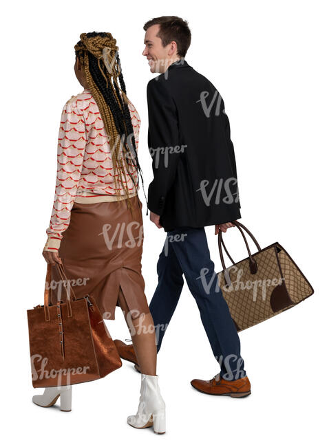 man and woman walking while talking happily
