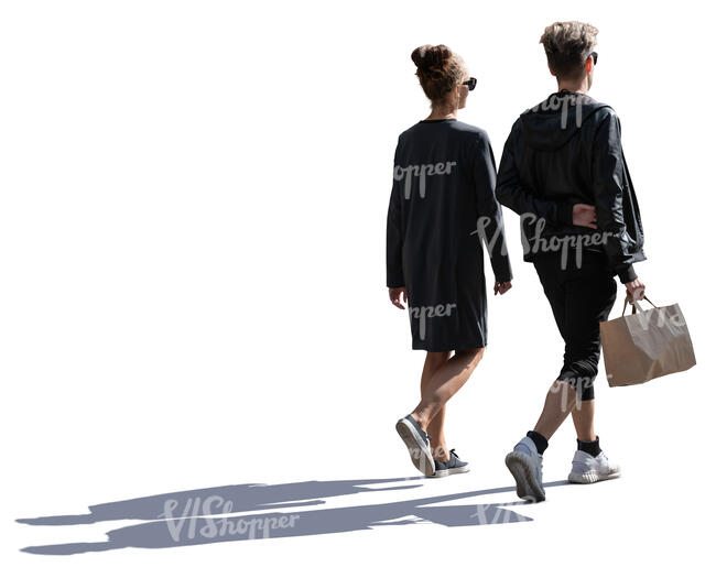 young backlit man and woman with a shopping bag