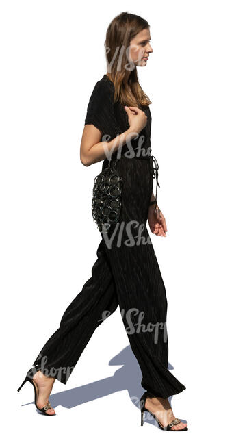 woman in a black jumpsuit walking