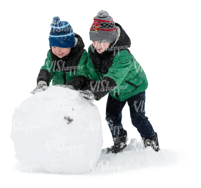 two boys building a large snowball