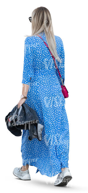 woman in a long blue summer dress walking