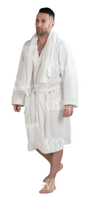 man in a white bathrobe walking