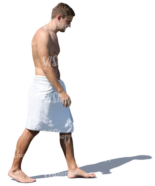 man in a white towel walking