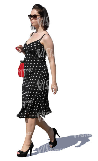 woman in a polka dot dress walking