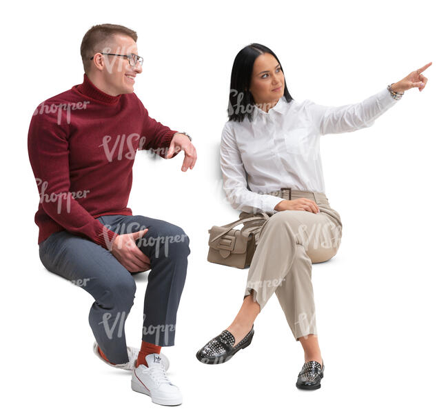 man and woman sitting and looking at smth