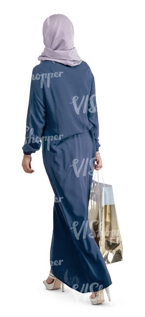 muslim woman with a shopping bag walking