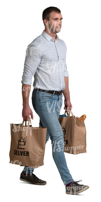 man with two big grocery bags walking