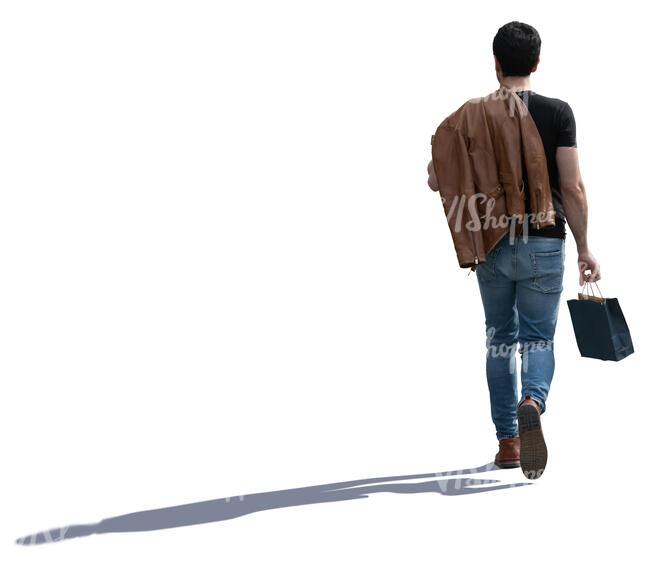 young backlit man with a small shopping bag walking