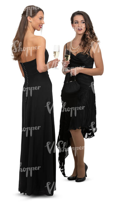 two women in black evening dresses at a formal event standing and talking