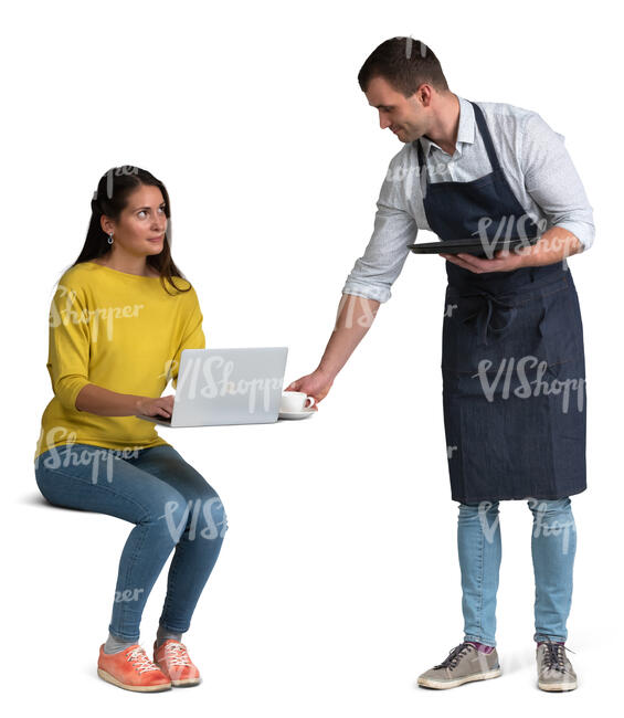 waiter bringing coffee to a woman sitting at a table