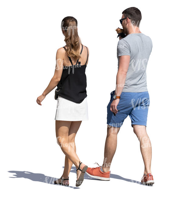 man and woman walking and eaitng ice cream