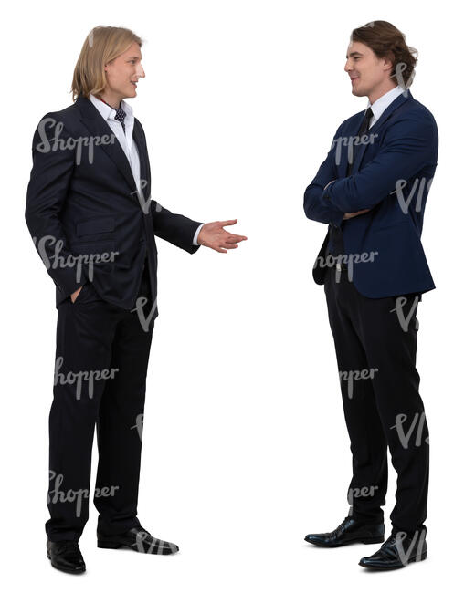 two men in suits standing and talking