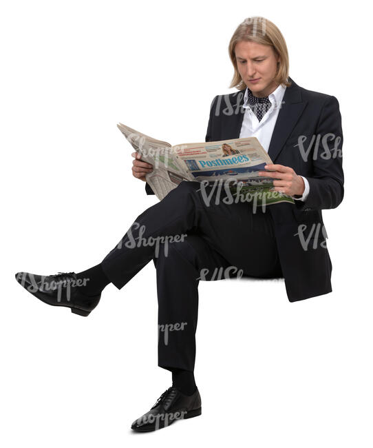 man in a suit sitting and reading a newspaper