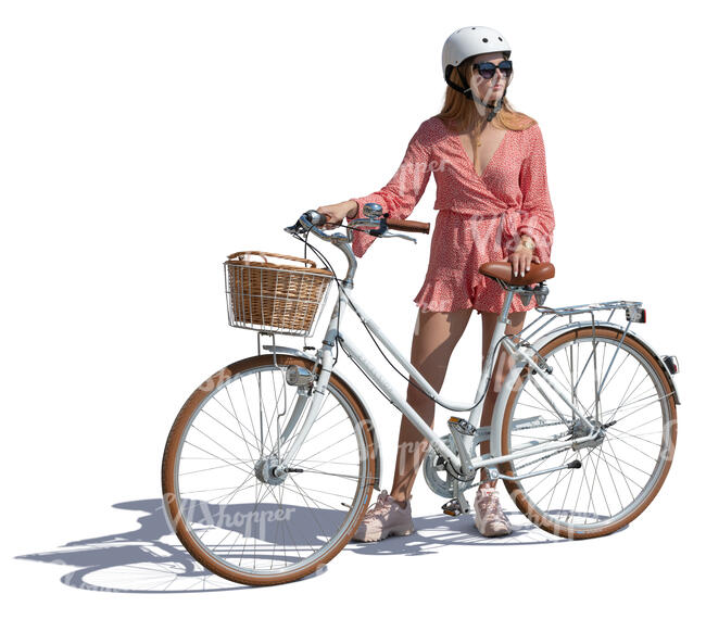 woman with a helment standing by a bicycle