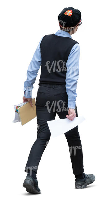 schoolboy in school uniform walking