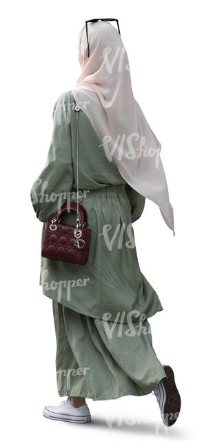 muslim woman in khaki green outfit walking