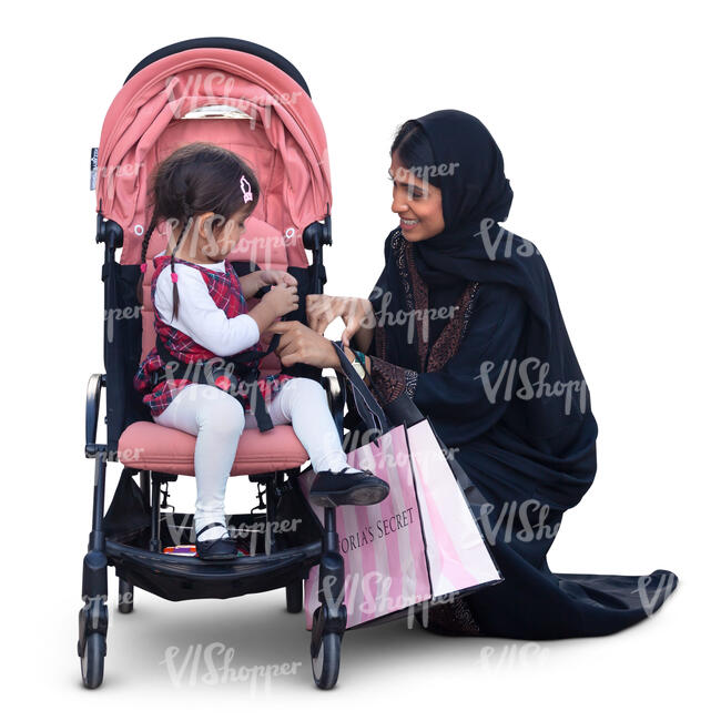 muslim woman squatting by the baby stroller