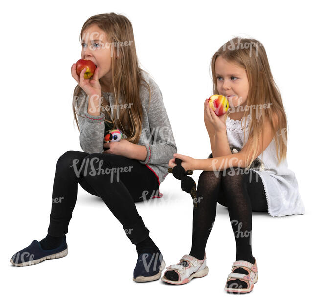 two girls sitting and eating apples