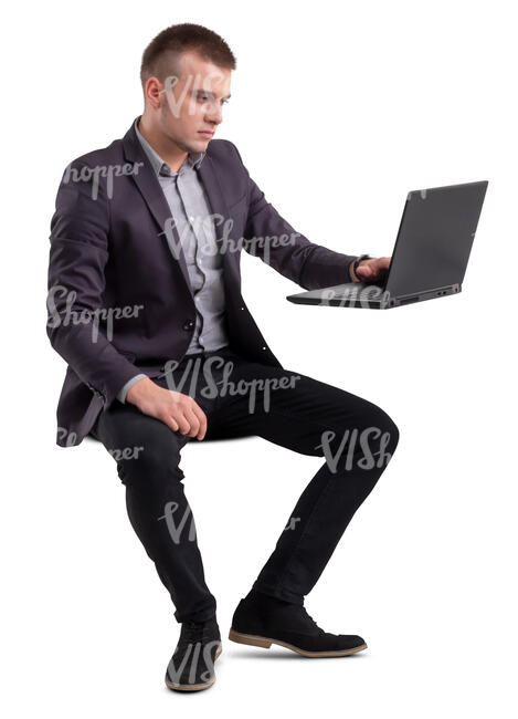 man sitting at an office table and working with computer
