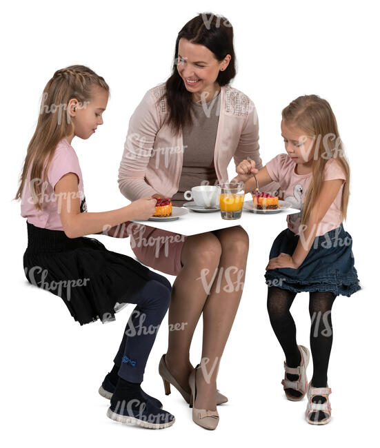 mother with two kids eating cake at a cafe